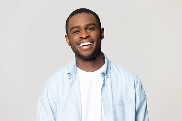 Handsome Black man with a fabulous smile thanks to a Lumineers procedure